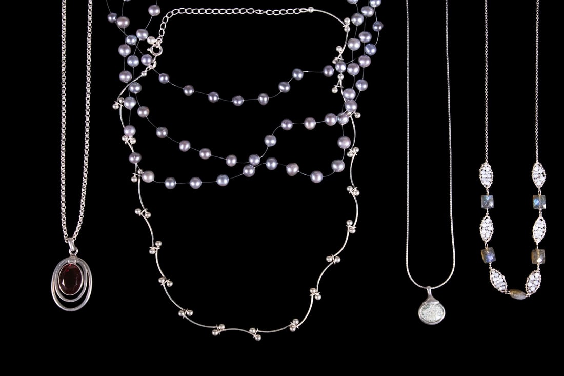 (5) VINTAGE STERLING SILVER NECKLACES: (5) VINTAGE STERLING SILVER NECKLACES A group of five sterling silver necklaces, including a multi-strand gray freshwater pearl necklace with toggle clasp, a modernist silver bead necklace, a necklace