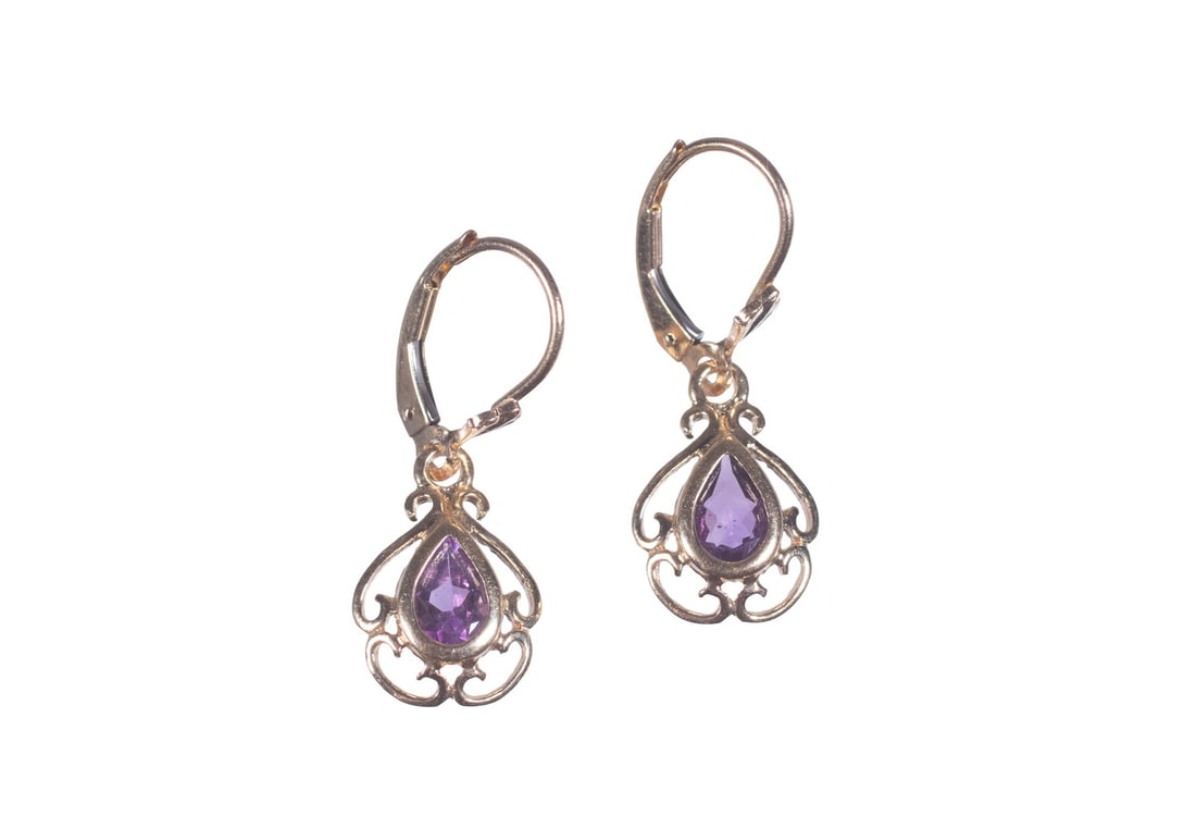 PR 14K GOLD AMETHYST DROP EARRINGS: PR 14K GOLD AMETHYST DROP EARRINGS A pair of 14K gold drop earrings, each set with a pear-shaped amethyst measuring approximately 5.84 x 3.95 mm. The stones are framed within delicate openwork gold se