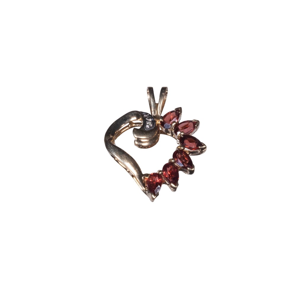 VINTAGE 10K GOLD, GARNET, AND DIAMOND PENDANT: VINTAGE 10K GOLD, GARNET, AND DIAMOND PENDANT A 10K yellow gold pendant designed in a stylized heart form, set with (6) pear-cut garnets of deep orange-red hue and accented by (2) small round-cut diam
