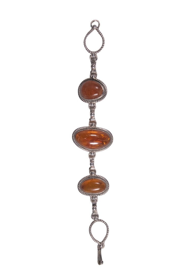EUROPEAN SILVER MOUNTED AMBER LINK BRACELET: EUROPEAN SILVER MOUNTED AMBER LINK BRACELET 800-Silver Link Bracelet, three links with natural shape amber stones. 0.95 ozt tw. Length: 7 1/2 in. (19.1 cm.)