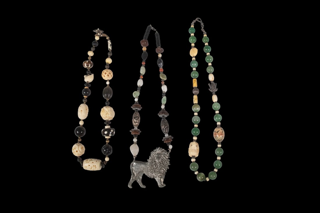 (3) DECORATIVE BEADED NECKLACES: (3) DECORATIVE BEADED NECKLACES Comprising a necklace of carved faux ivory-style and black beads, a necklace of green chrysoprase beads with carved and decorated accent beads, and a mixed-media beaded