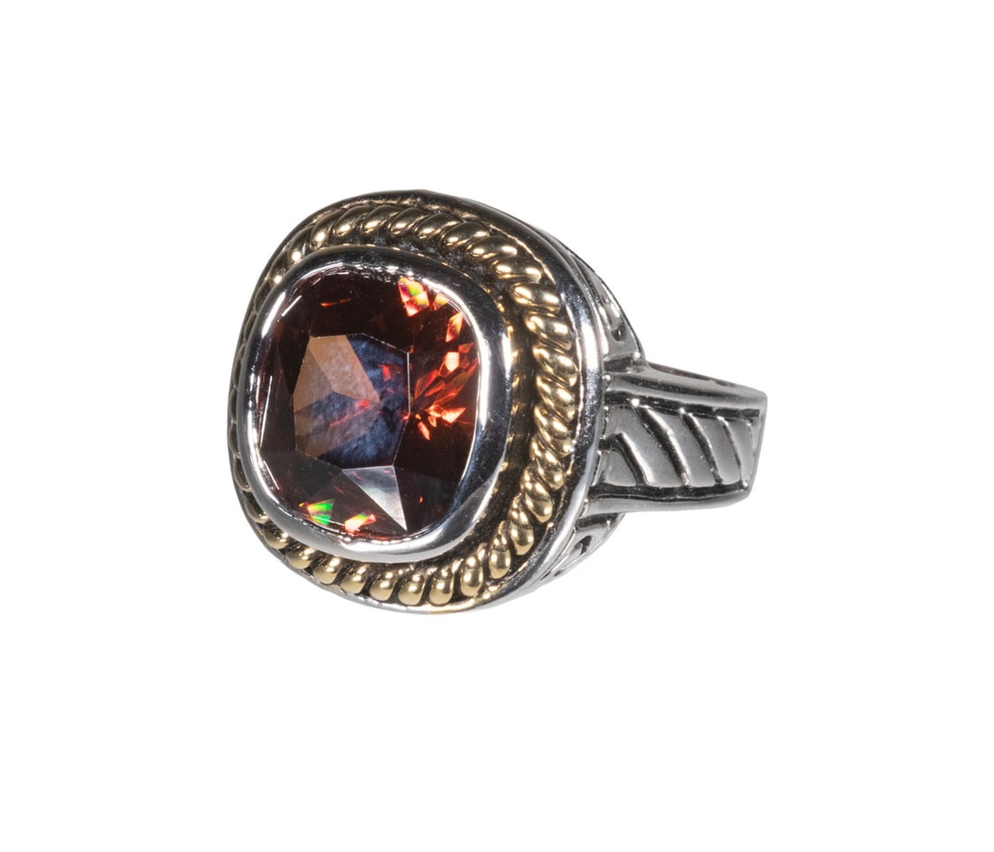 DAVID YURMAN STYLE STERLING SILVER RING: DAVID YURMAN STYLE STERLING SILVER RING A sterling silver ring with gold-tone accents in the David Yurman style, featuring a large cushion-shape, faceted dark orange glass center stone within a
