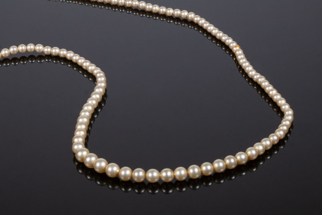 VINTAGE RICHELIEU 18K GOLD AND SIMULATED PEARL NECKLACE: VINTAGE RICHELIEU 18K GOLD AND SIMULATED PEARL NECKLACE A single-strand necklace composed of graduated simulated pearl, ranging up to approx. 5mm, exhibiting soft ivory tone and good luster.