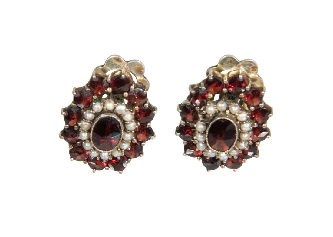PR SILVER, GARNET & SEED PEARL EAR CLIPS: PR SILVER, GARNET & SEED PEARL EAR CLIPS Pair of Vintage 800-Silver Mounted Oval Earrings, each set with a center faceted garnet surrounded by a row of seed pearls and with an outer band of faceted