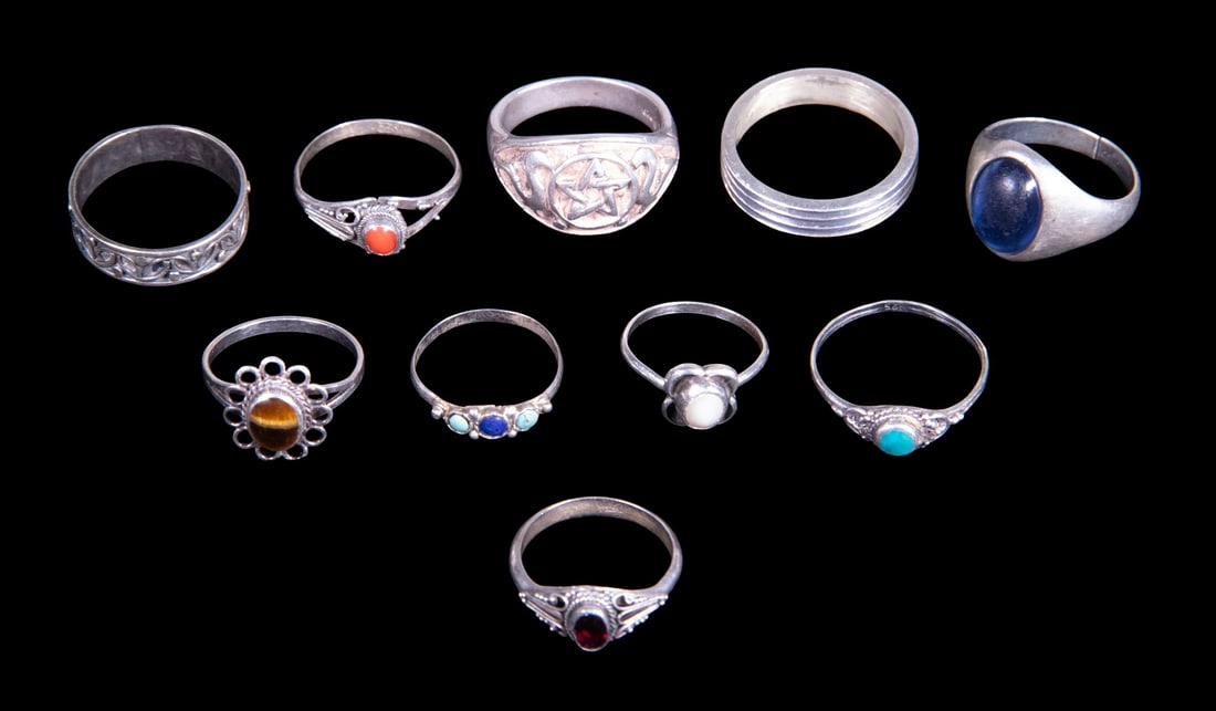 (10) STERLING SILVER RINGS WITH VARIOUS STONES AND DESIGNS: (10) STERLING SILVER RINGS WITH VARIOUS STONES AND DESIGNS A group of ten sterling silver rings in assorted styles, including examples set with colored stones such as turquoise, garnet, and tiger?s