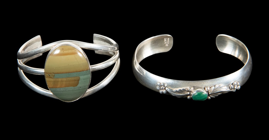 (2) STERLING SILVER CUFF BRACELETS WITH STONES: (2) STERLING SILVER CUFF BRACELETS WITH STONES Lot of (2) Bracelets, set with polished stones, incl: Cuff with polished turquoise stone and raised floral and leaf design, marked sterling, 1/2" wide,