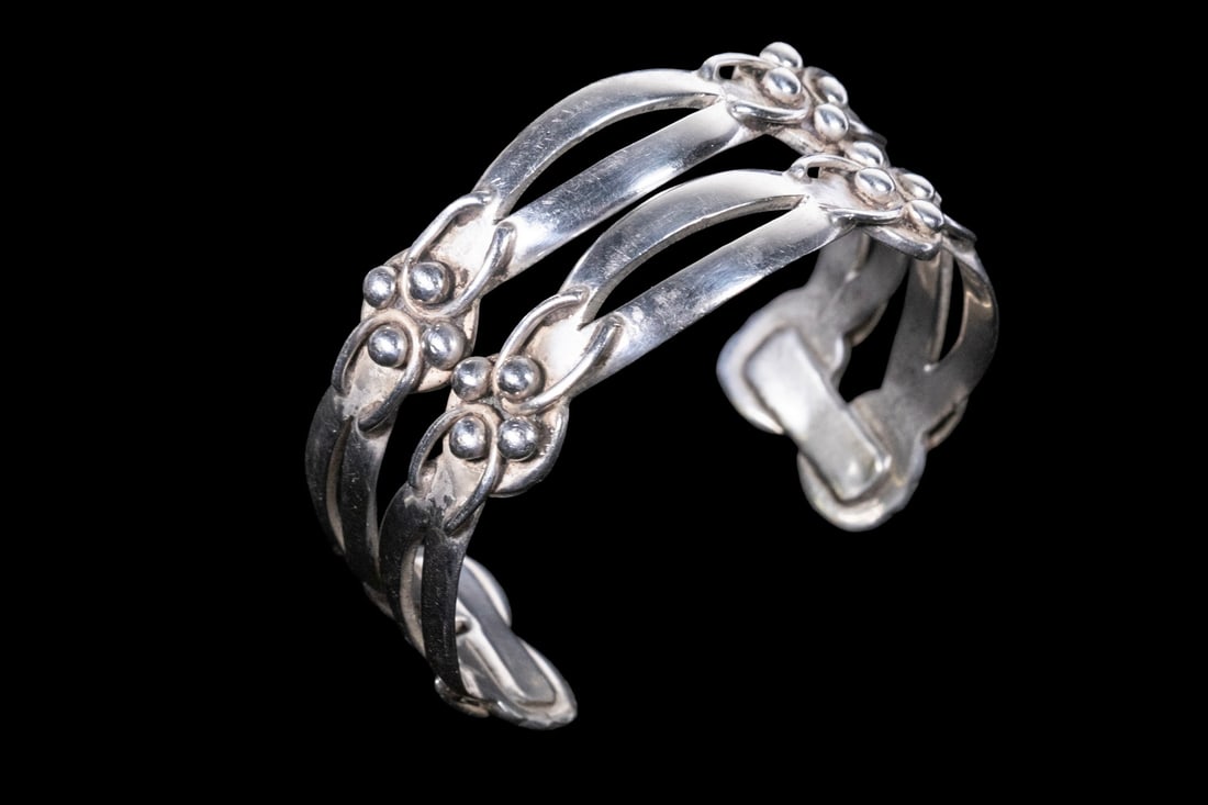 MARICELA (ISIDRO GARCIA) MEXICAN TAXCO STERLING SILVER CUFF BRACELET: MARICELA (ISIDRO GARCIA) MEXICAN TAXCO STERLING SILVER CUFF BRACELET A vintage Mexican sterling silver cuff bracelet by Maricela of Taxco, featuring an openwork multi-band design with stylized scrolli