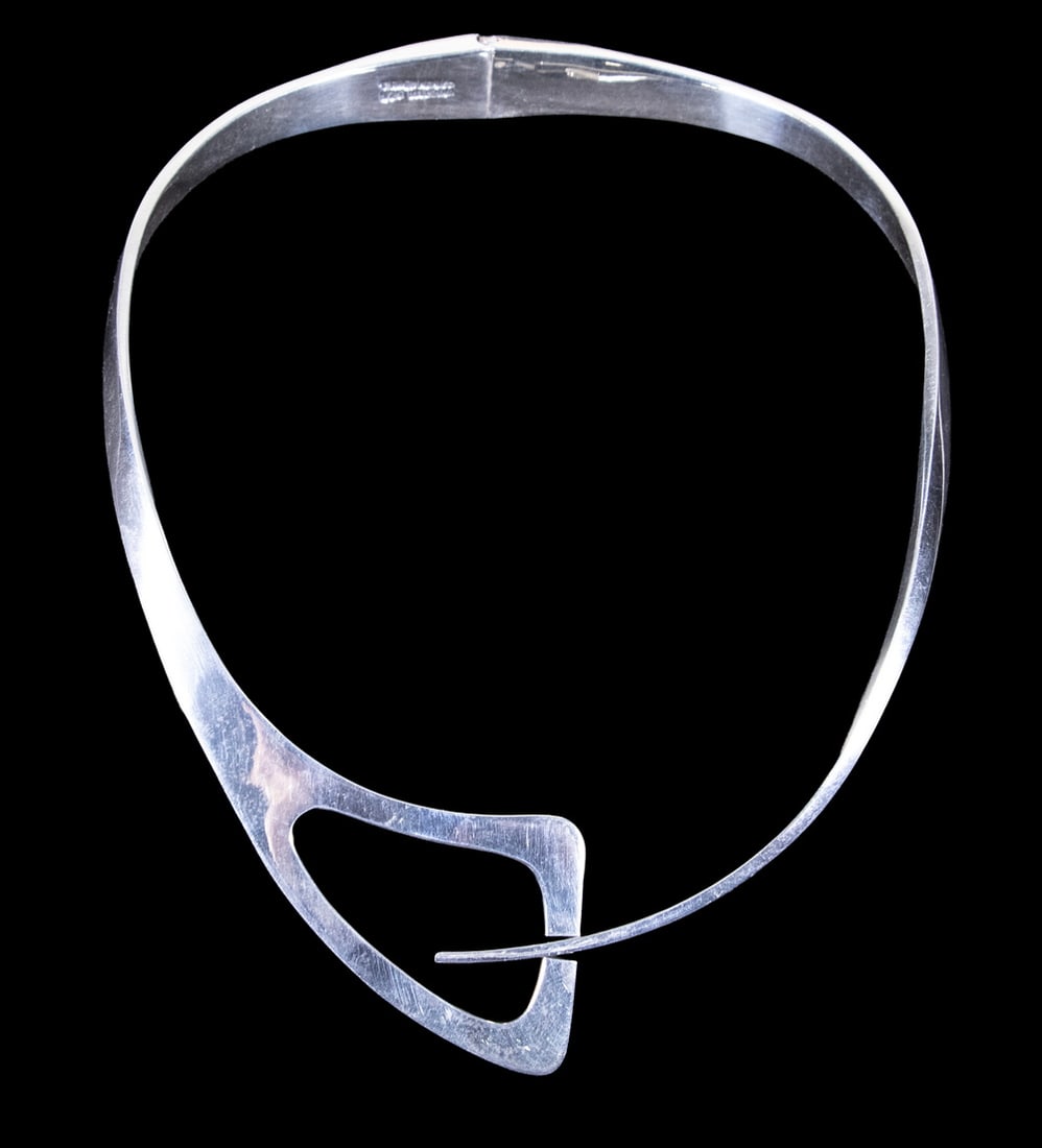 MEXICAN TAXCO STERLING SILVER MODERNIST TORQUE NECKLACE: MEXICAN TAXCO STERLING SILVER MODERNIST TORQUE NECKLACE A Mexican sterling silver torque-style hinged necklace of modernist design, featuring a sculptural asymmetrical front element forming an