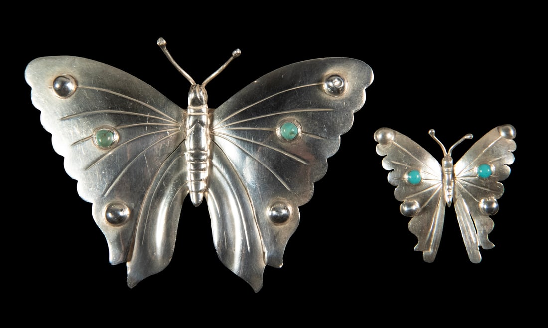 (2) MEXICAN SILVER & TURQUOISE BUTTERFLY PINS: (2) MEXICAN SILVER & TURQUOISE BUTTERFLY PINS Lot of (2) Vintage Sterling Silver Brooches, both set with round turquoise stones, the larger with CA maker's mark (unknown maker); and the smaller by