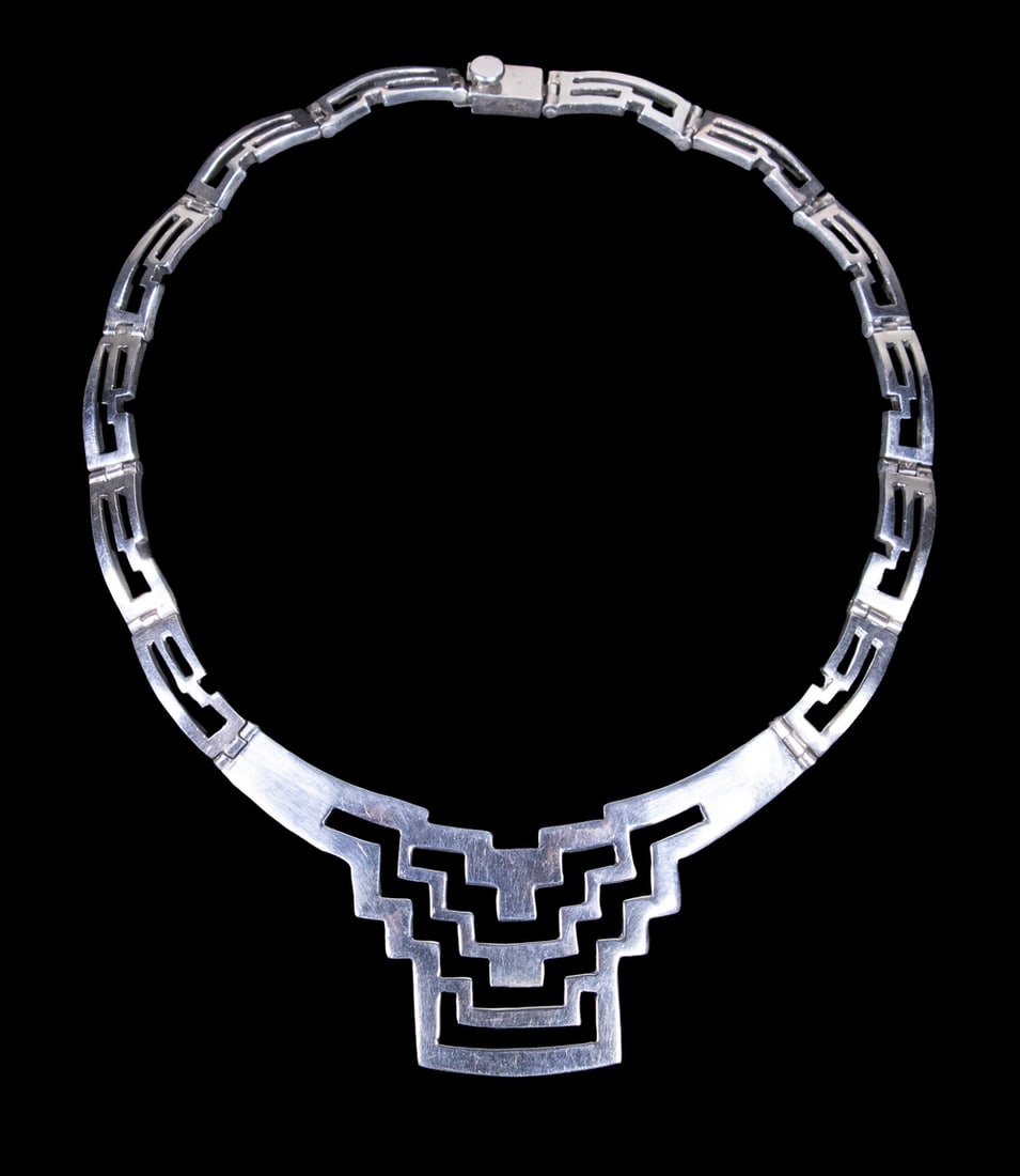 MEXICAN TAXCO STERLING SILVER LINK NECKLACE: MEXICAN TAXCO STERLING SILVER LINK NECKLACE A Mexican sterling silver necklace from Taxco, composed of articulated openwork links and featuring a stepped geometric front element. Flexible construction