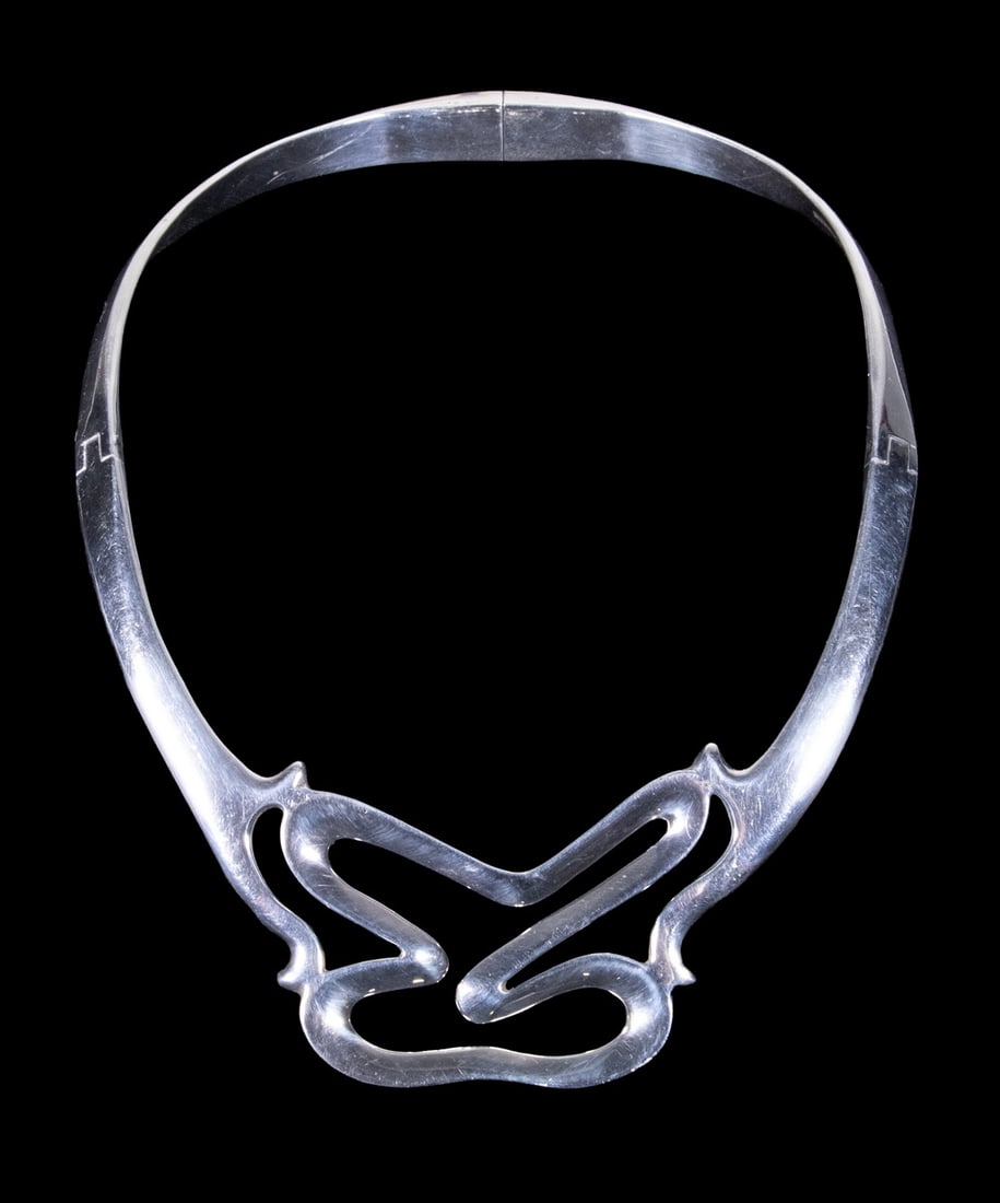 MEXICAN TAXCO STERLING SILVER MODERNIST TORQUE NECKLACE: MEXICAN TAXCO STERLING SILVER MODERNIST TORQUE NECKLACE A striking Mexican sterling silver torque necklace of sculptural modernist design, featuring a bold, flowing abstract front element with organic
