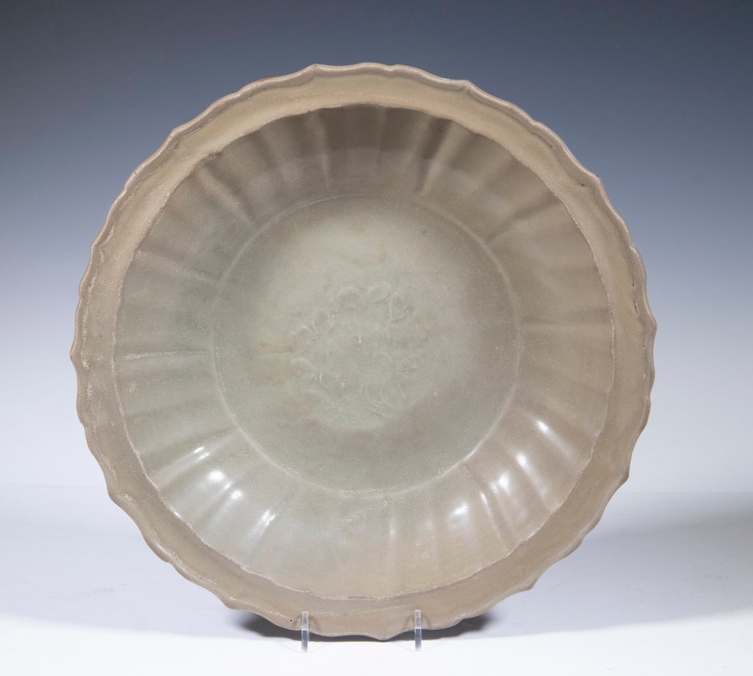 CHINESE FOOTED BOWL: CHINESE LONGQUAN STYLE CELADON BOWL Celadon Glazed Footed Bowl, Longquan style, with shaped rim, ribbed interior with floral design. Good condition. OS: 2 3/4 x 13 1/4 x 13 1/4 in. (7 x 33.7 x 33.7