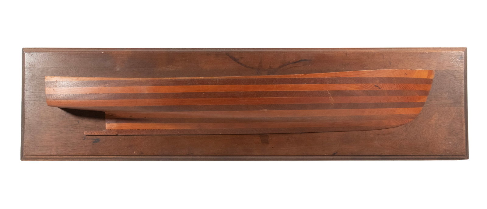 CIRCA 1900 LAMINATED HALF HULL COASTAL SCHOONER?: CIRCA 1900 LAMINATED HALF HULL COASTAL SCHOONER? Brow Bow Half Hull in laminated mahogany and spruce, with mahogany plaque. OS: 10 x 40 x 6 in. (25.4 x 101.6 x 15.2 cm.)