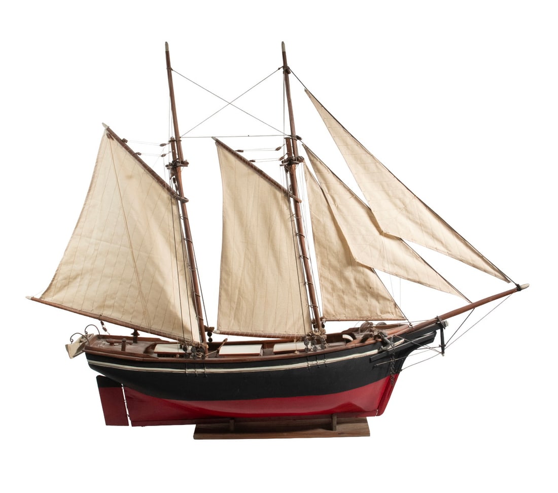 CUSTOM MODEL OF COASTAL SCHOONER CIRCA 1910: CUSTOM MODEL OF COASTAL SCHOONER CIRCA 1910 Black Hulled Two-Mast Schooner, with cotton sails, loose on stand. OS: 34 x 46 x 7 1/2 in. (86.4 x 116.8 x 19.1 cm.)