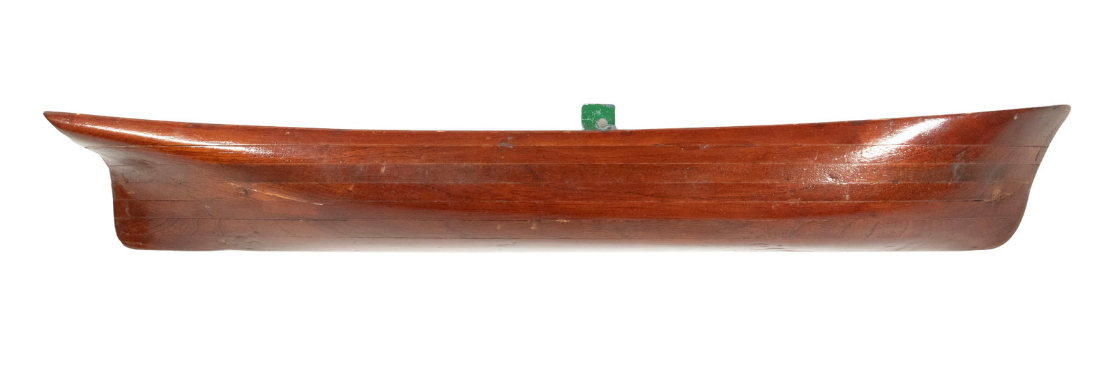 SMALL LAMINATED HALF HULL: SMALL LAMINATED HALF HULL Mahogany, probably for schooner, found in Nantucket. OS: 4 x 29 x 3 1/2 in. (10.2 x 73.7 x 8.9 cm.)