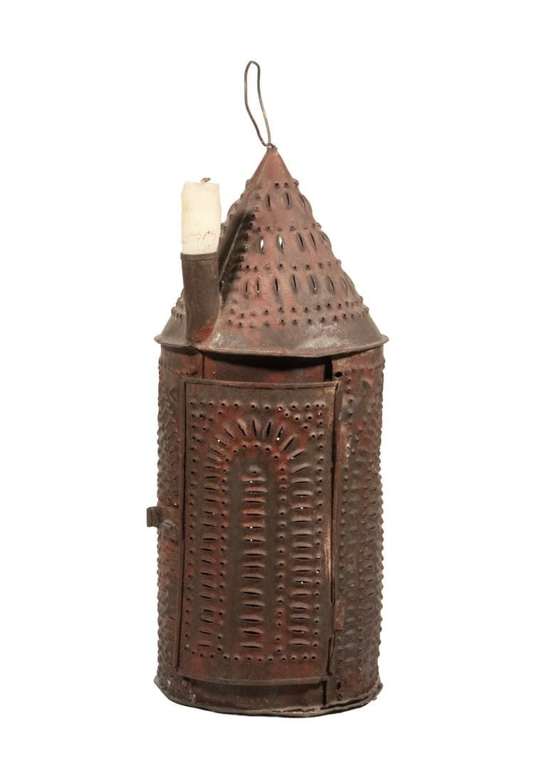 PUNCHED TIN LANTERN WITH EXTERIOR CANDLE: PUNCHED TIN LANTERN WITH EXTERIOR CANDLE 19th c. Rustic American Candle Lamp, having traces of red painted surface, hinged door with single interior candle socket, plus a roof mounted exterior socket,