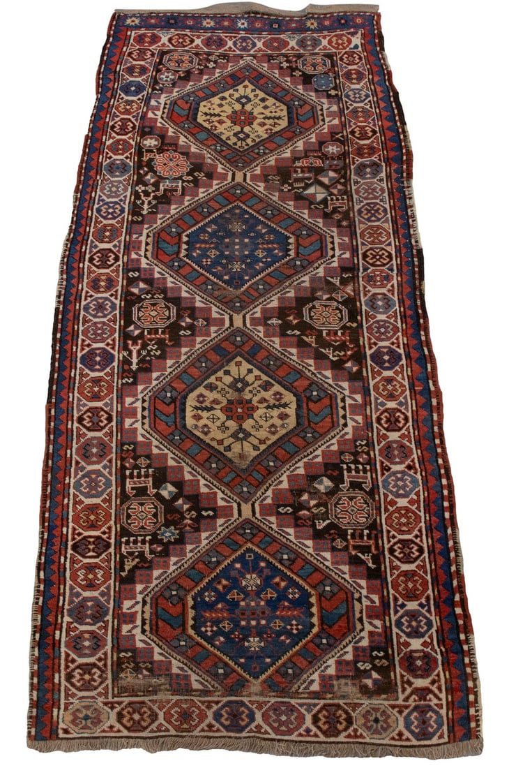 KAZAK LONG RUG (4' X 9'6"): KAZAK LONG RUG (4" X 9"6") Made in Southwest Caucasus in the first quarter of the 20th century, Has four hexagonal medallions in red, navy & Persian blue, gold, ivory, & aubergine. Tan field and hexag