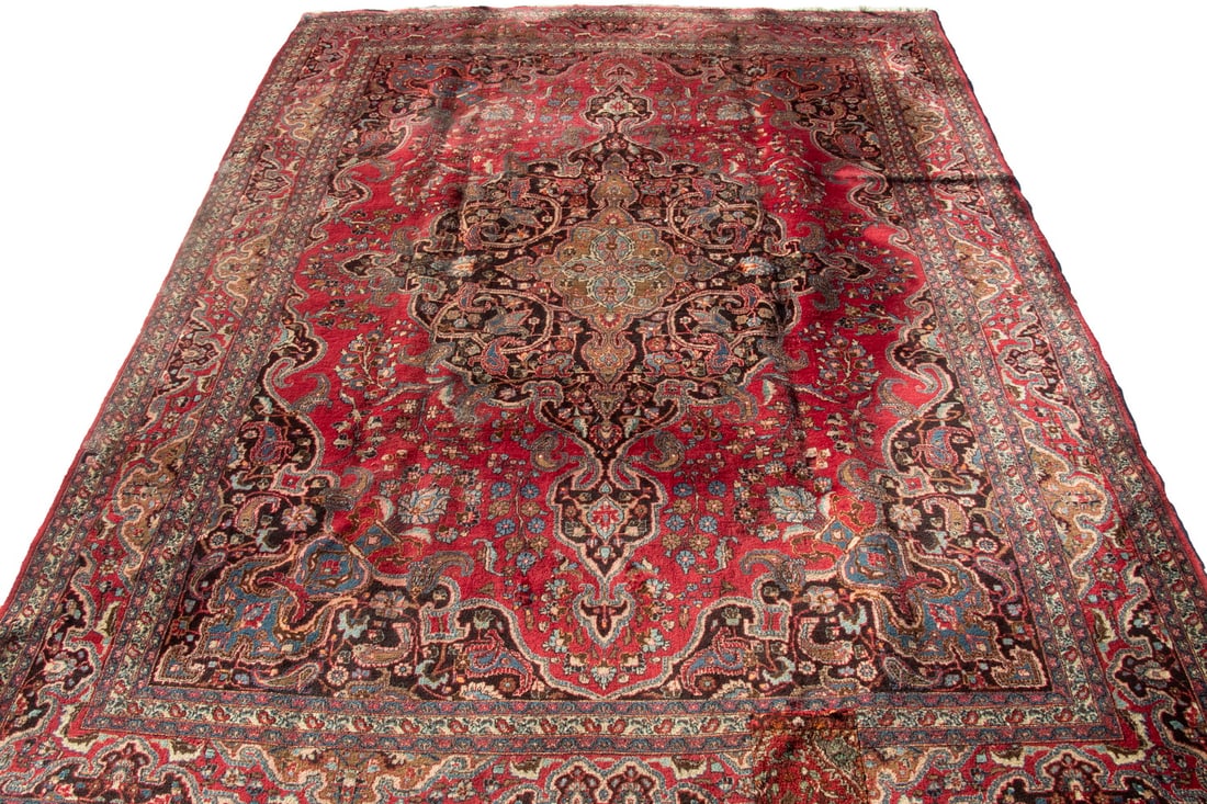 HERIZ CARPET (10'3" X 13'3"): HERIZ CARPET (10' 3" X 13' 3") Northwest Persian rug. Has a large serrated diamond medallion with anchor pendants and matching spandrels composed in: midnight/sky blue, rose, ivory, and gold. In the b