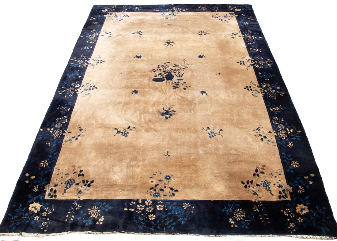 CHINESE CARPET (16'3" x 13'3"): CHINESE CARPET (16'3" x 13'3") An offering of a large Chinese deco rug. It features an open white field with dark blue border, centering around an image of three floral vases with bouquet designs