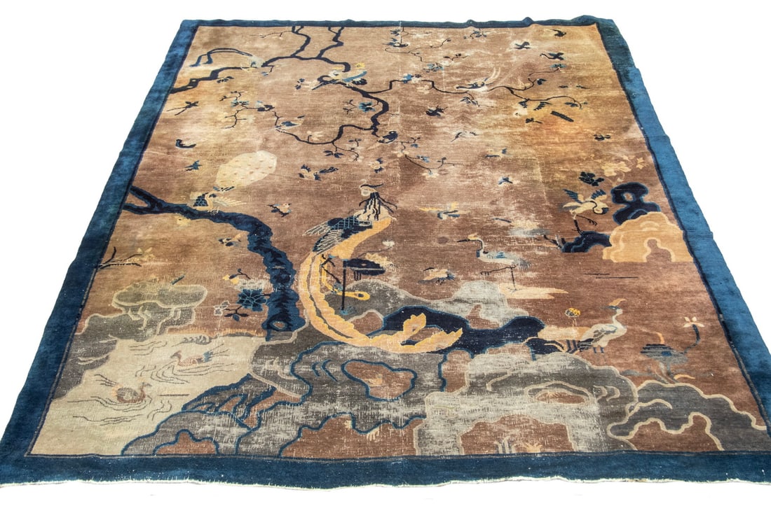 CHINESE DECO RUG (9'1" x 11'7"): CHINESE DECO RUG (9'1" x 11'7") An offering of a Chinese deco, pictographic rug. Features an image of an Asian pheasant at the base of a tree among cranes and flying sparrows with solid blue border. O