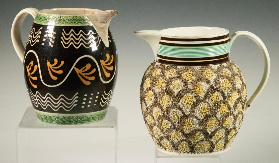 (2) EARLY 19TH C. ENGLISH STAFFORDSHIRE JUGS: (2) EARLY 19TH C. ENGLISH STAFFORDSHIRE JUGS Both Circa 1810, Incl: Gravel-ware pitcher, with gritty exterior surface and glazed in Prattware colors, and with slip banded rim, spout and base