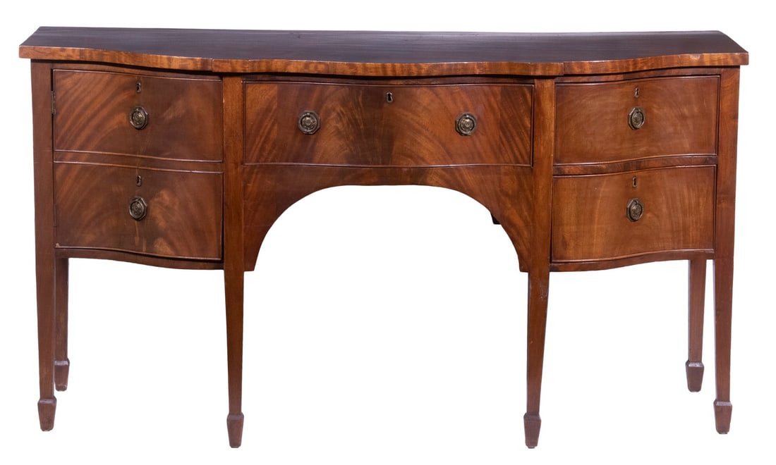 ENGLISH SIDEBOARD: ENGLISH SIDEBOARD Hepplewhite Style, in mahogany, 1920s vintage, blocked serpentine top, having a high figuring swirling from a single knot, beaded edge drawers with brass ring pulls, ochre felted