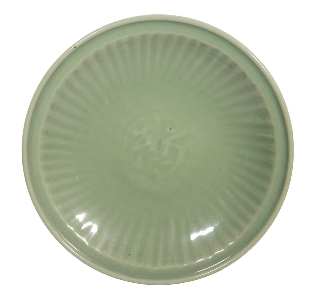 CHINESE LONGQUAN CELADON GLAZED CHARGER: CHINESE LONGQUAN CELADON GLAZED CHARGER A large Chinese Longquan celadon glazed charger with molded chrysanthemum petal decoration beneath a pale green glaze. The center impressed with a stylized