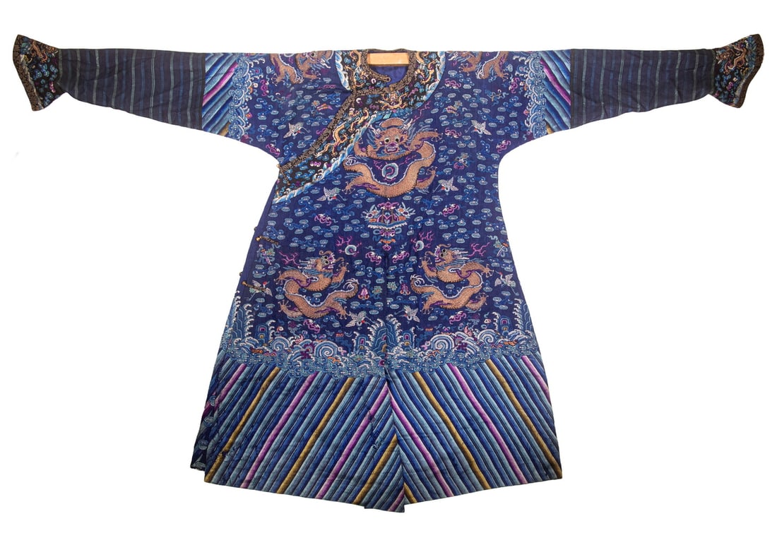 CHINESE BLUE GROUND SUMMER DRAGON ROBE, LATE QING DYNASTY: CHINESE BLUE GROUND SUMMER DRAGON ROBE, LATE QING DYNASTY Finely worked blue gauze summer robe embroidered with five-clawed dragons amid scrolling clouds, cranes, and auspicious emblems above lishui