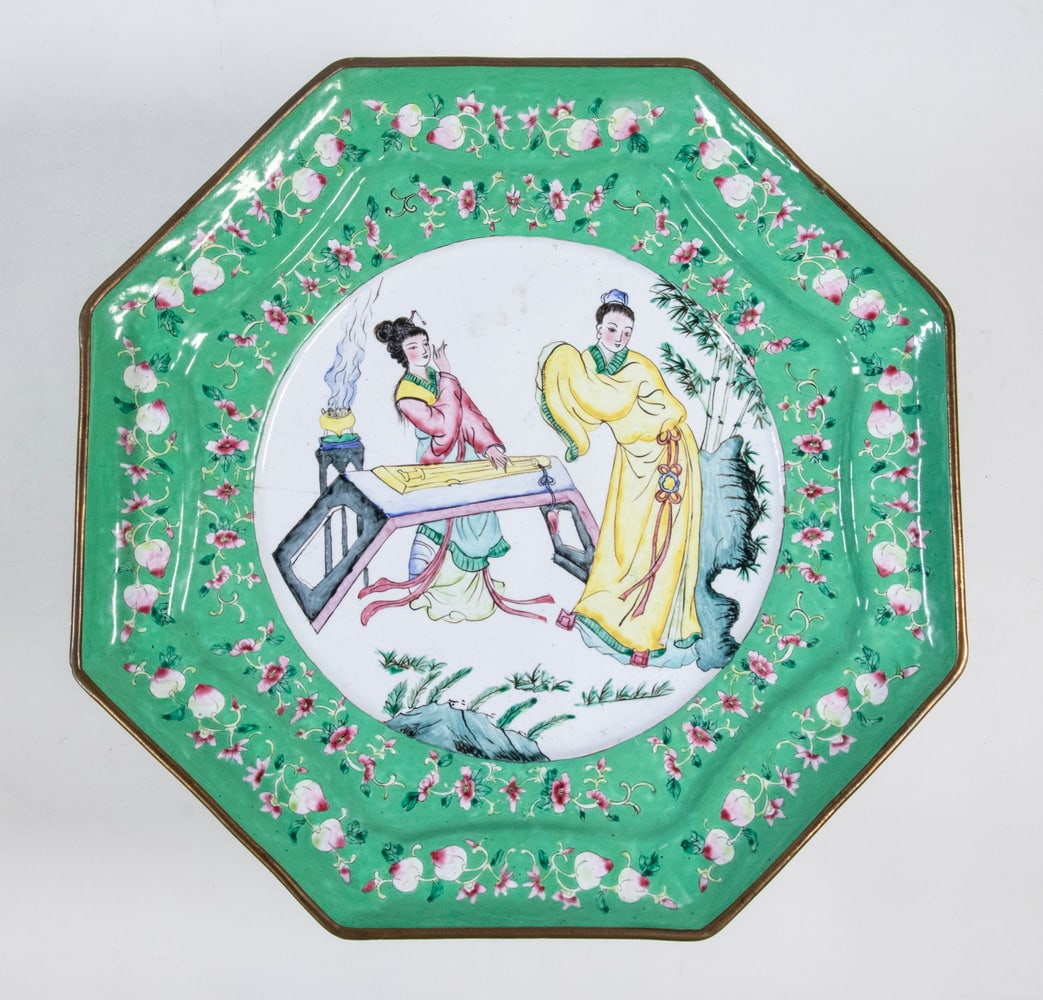 CHINESE CANTON ENAMEL ON COPPER PLATE: CHINESE CANTON ENAMEL ON COPPER PLATE Chinese Hand Painted Enamel Octagonal Plate, centered with an image of two young women, one playing a guqin and the other dancing, surrounded by floral swags, gre