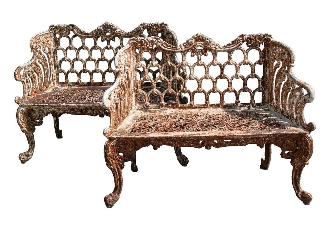 MATCHED PAIR OF C1870 VICTORIAN CAST IRON GARDEN BENCHES: MATCHED PAIR OF C1870 VICTORIAN CAST IRON GARDEN BENCHES Two-Seater in weathered white paint, with shaped back in 'scales', wing form arms, pierced seat. cabriole legs. 18" seat, 27" arms. Size: ea. 5