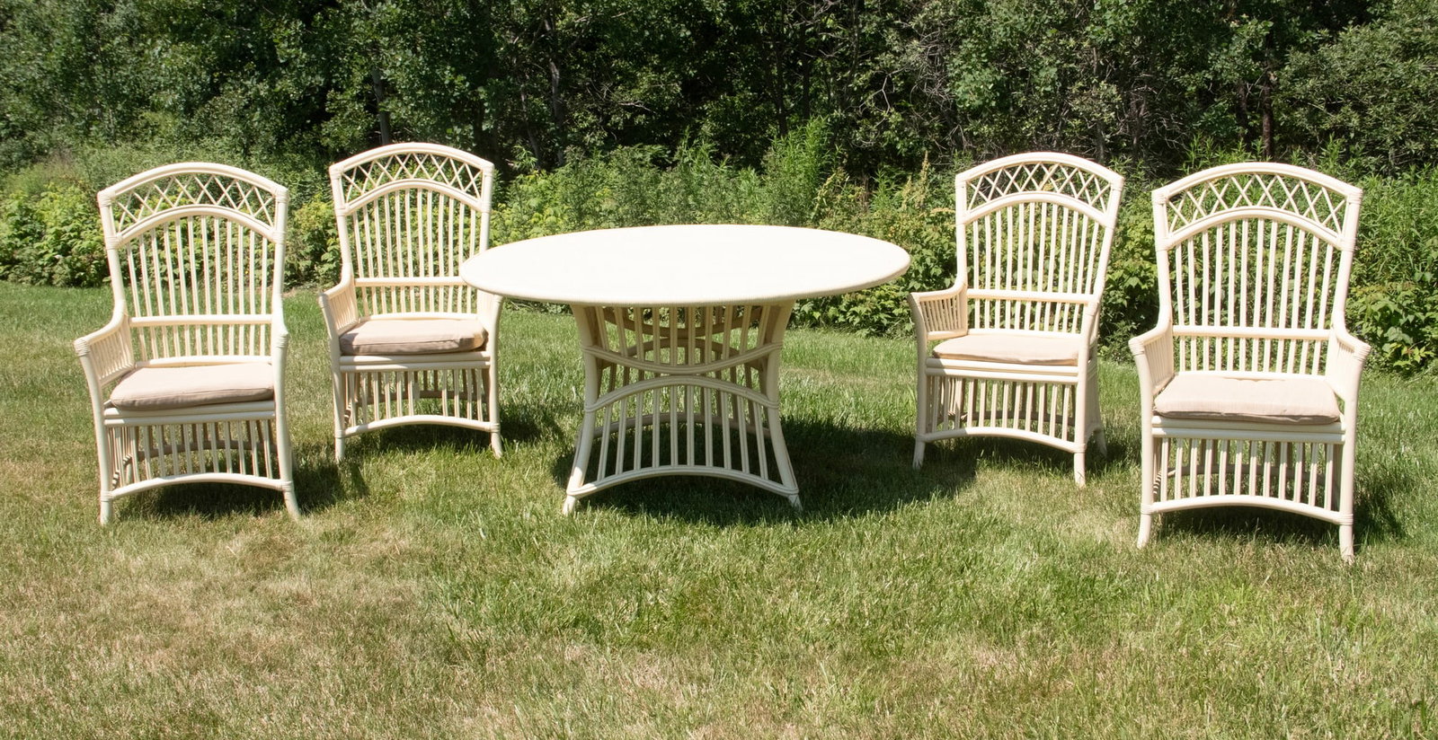 (5 PC) PATIO BAMBOO DINING SET, BOOTHBAY STYLE IN BUTTER ENAMEL PAINT: (5 PC) PATIO BAMBOO DINING SET, BOOTHBAY STYLE IN BUTTER ENAMEL PAINT Consisting of (4) Armchairs with sand colored tie-on cushions, the woven bamboo covered table top mounted by screw on battens to