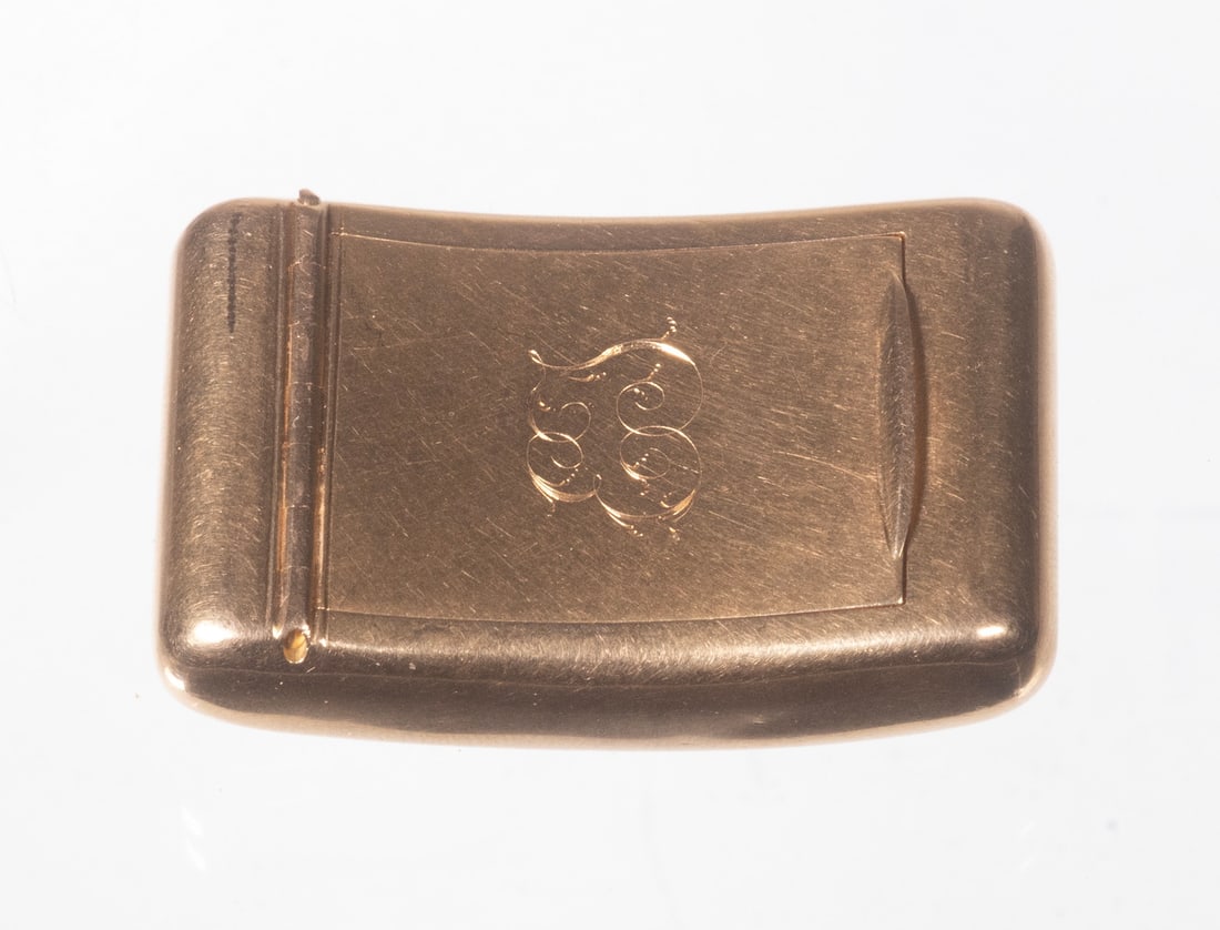 ANTIQUE 14K GOLD MONOGRAMMED PILL BOX: ANTIQUE 14K GOLD MONOGRAMMED PILL BOX Rectangular 14K yellow gold case of gently curved form, the lid engraved with an intertwined script monogram “EF”, opening to a polished gold interior.