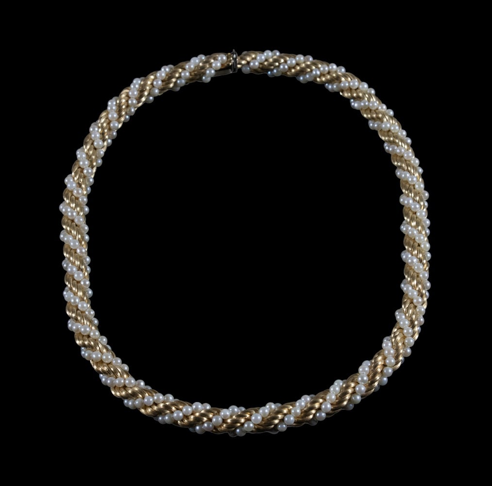 ITALIAN 18K GOLD AND PEARL TORSADE NECKLACE: ITALIAN 18K GOLD AND PEARL TORSADE NECKLACE Comprised of twisted rope-form 18K yellow gold strands intricately interwoven with cultured pearls, completed by a concealed box clasp with safety catch.