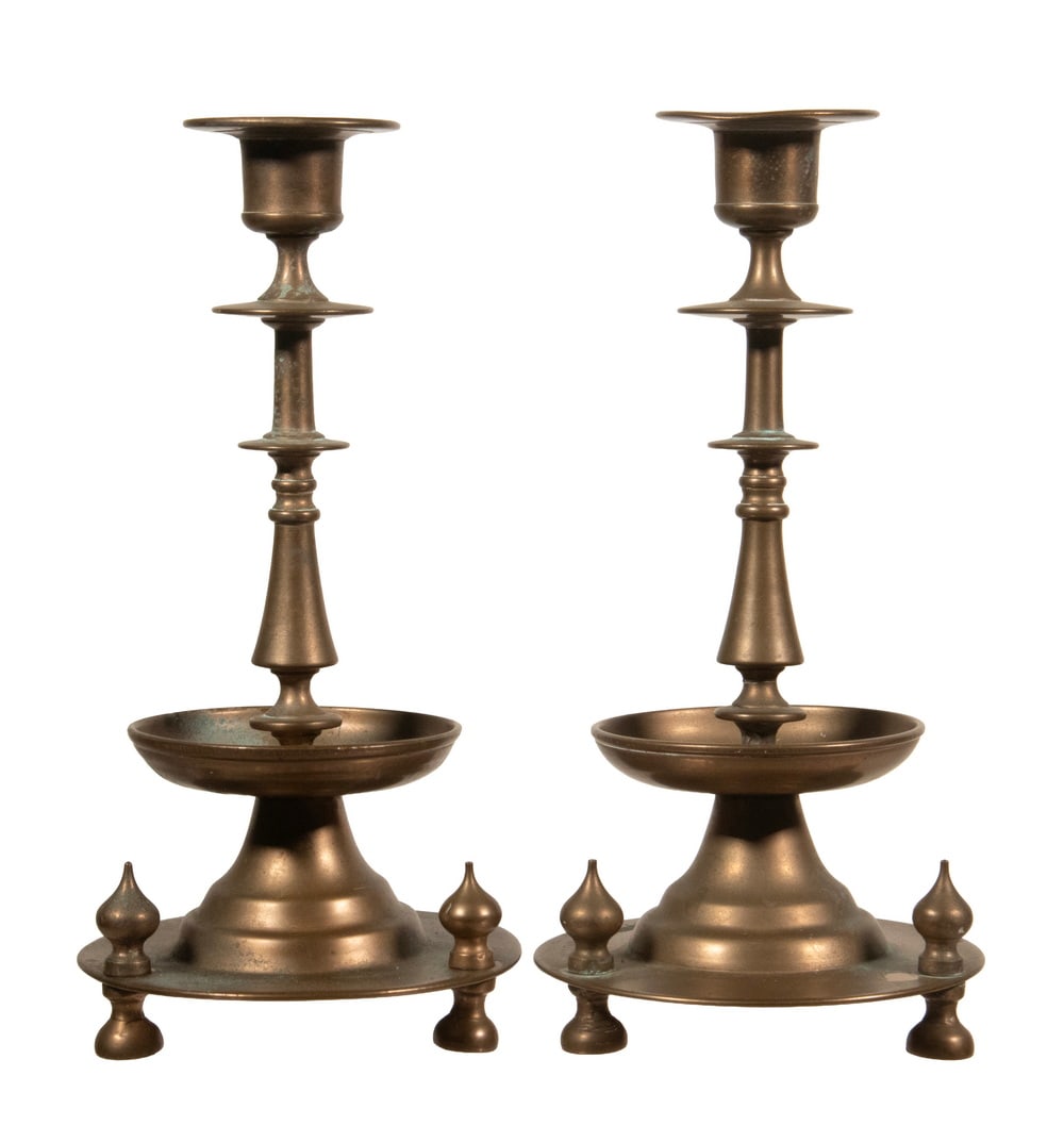 PR YUDIN RUSSIAN BRASS SABBATH CANDLESTICKS: PR YUDIN RUSSIAN BRASS SABBATH CANDLESTICKS Pair of 19th c. Russian Empire Candleholders, both signed in Cyrillic letters "?. Yudin." Each with flared rim, turned stem, mid-stem drip pans, set on a