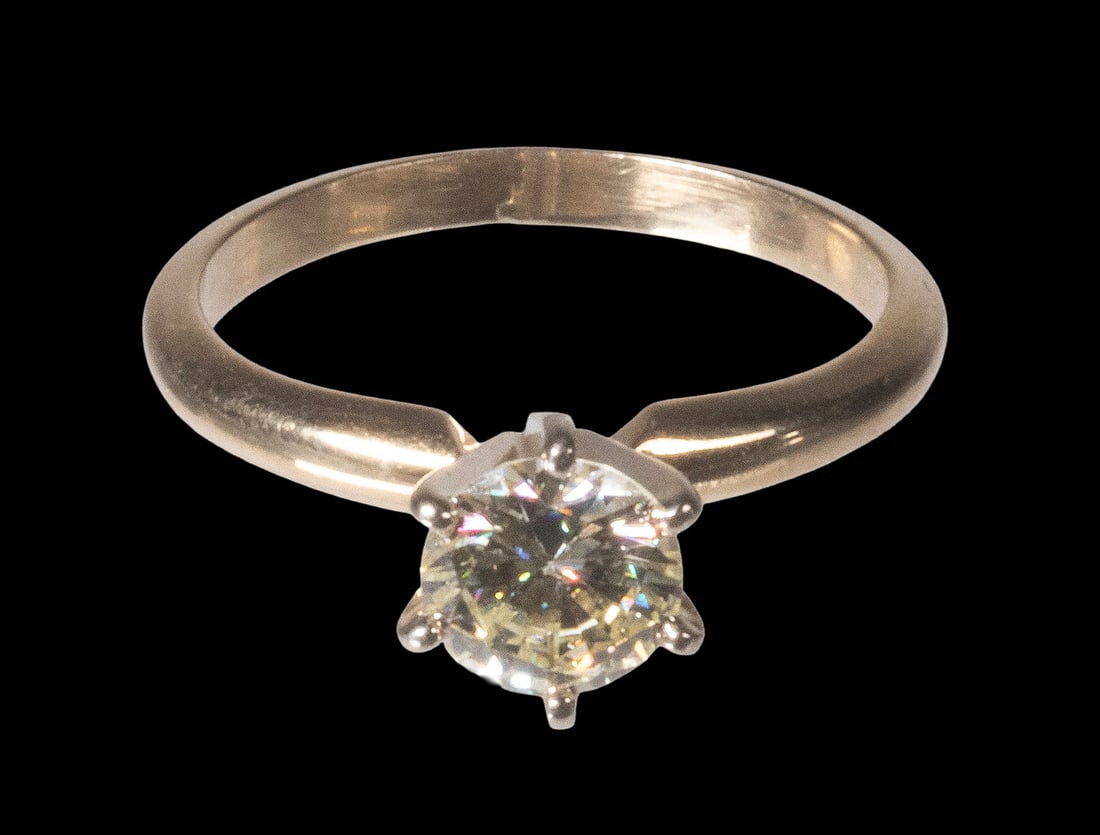 VINTAGE 14K GOLD DIAMOND SOLITAIRE RING: VINTAGE 14K GOLD DIAMOND SOLITAIRE RING Set with one round brilliant-cut diamond in a classic six-prong mounting. Diamond measures approximately 6.21 mm in diameter, weighing approximately 0.90-1.00