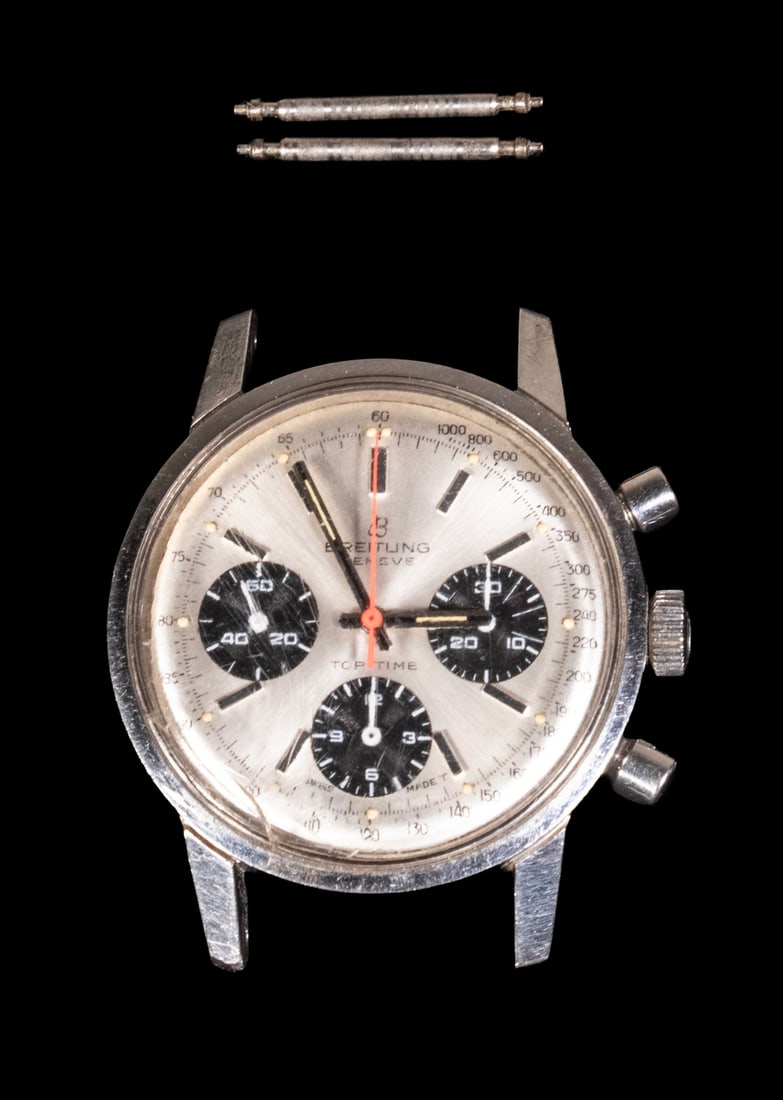 VINTAGE BREITLING TOP TIME CHRONOGRAPH WRISTWATCH: TIFFANY & CO. STERLING OVAL FOOTED CENTER BOWL Circa 1900 American Silver Serving Bowl, with rolled rim, ornate repousse floral decoration, shell and scroll motif rim, set on paw feet, the base
