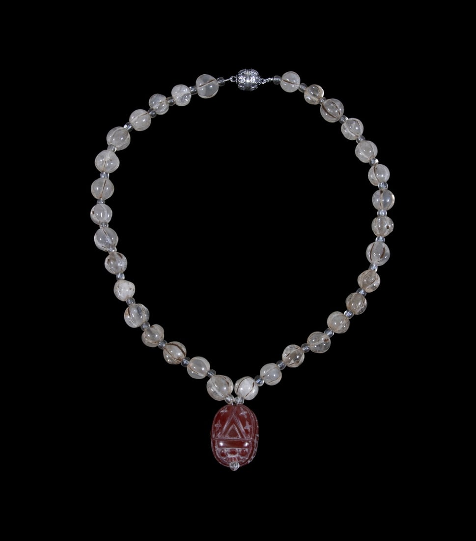 ELLEN WINDEMUTH SCARAB AND CENTAUR INTAGLIO NECKLACE: ELLEN WINDEMUTH SCARAB AND CENTAUR INTAGLIO NECKLACE A studio jewelry necklace by Ellen Windemuth, composed of Nepalese quartz melon beads with quartz spacers, centered by a Near Eastern carnelian