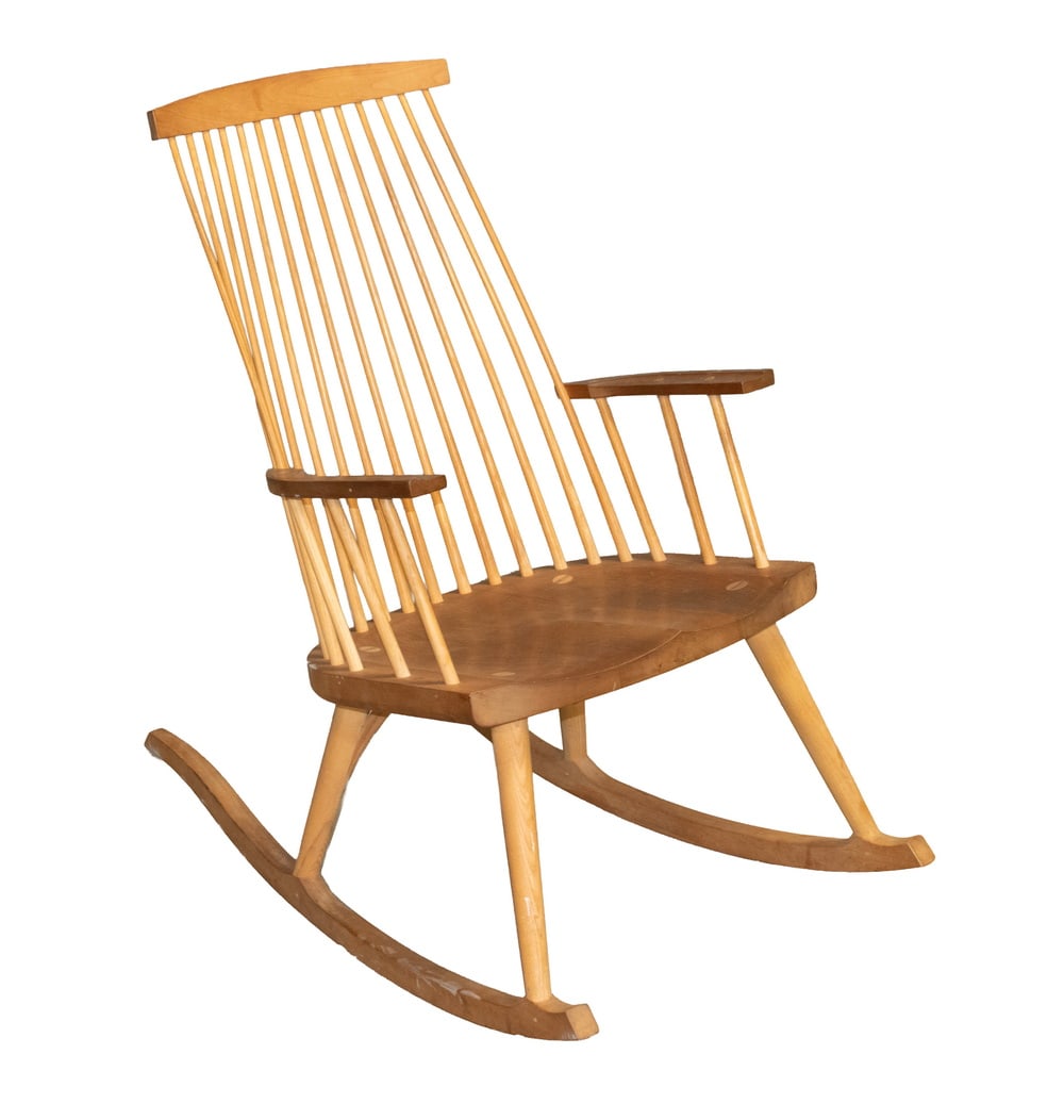 THOS. MOSER CABINETMAKERS "NEW GLOUCESTER" ROCKER: THOS. MOSER CABINETMAKERS "NEW GLOUCESTER" ROCKER Hand Crafted Rocking Chair, in cherry and ash wood, with carved crest, fourteen back spindles, flat arms, and shaped seat, unsigned. OS: 39 x 23 x 37