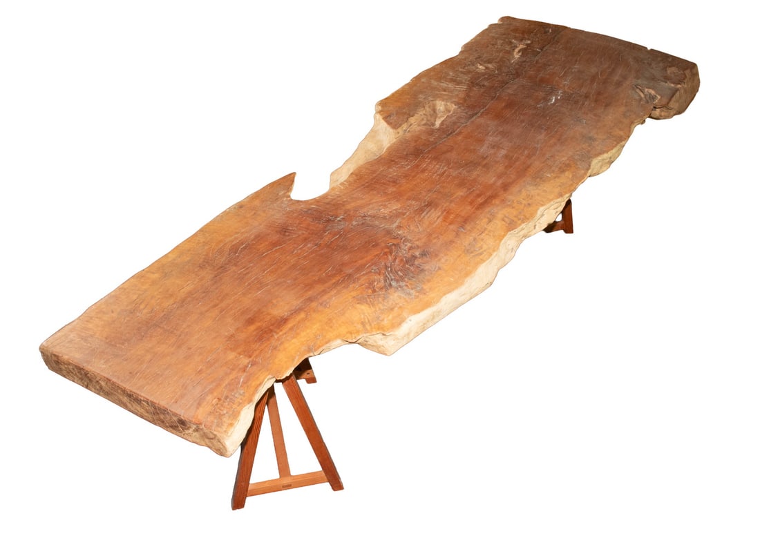 LIVE EDGE REDWOOD BURL PLANK COFFEE TABLE: LIVE EDGE REDWOOD BURL PLANK COFFEE TABLE Custom Crafted Low Table, with a thick redwood burl plank top, set on two sawbuck form base supports, 2 1/2" to 3" thick plank. OS: 18 x 27 x 79 in. (45.7 x