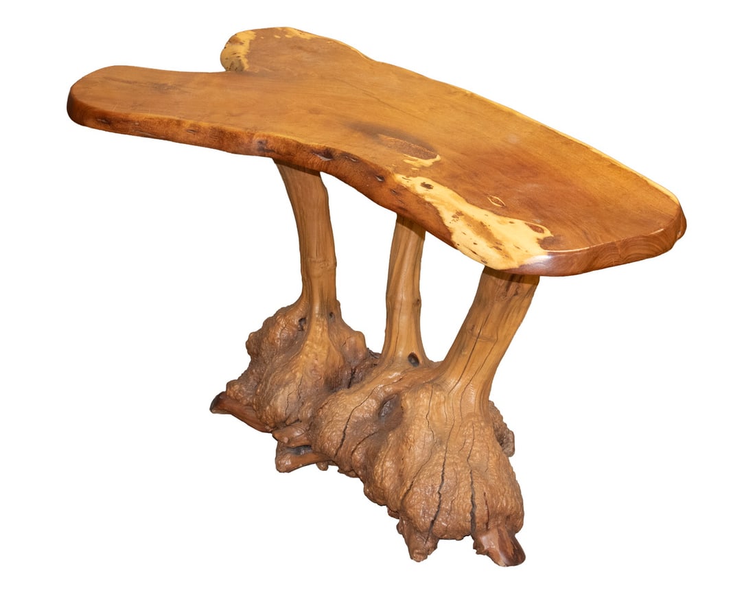 LIVE EDGE TEAK ROOT HALL TABLE: LIVE EDGE TEAK ROOT HALL TABLE Custom Natural Teak Table, with polished live edge top, set on a gnarly root base. OS: 28 x 48 x 26 in. (71.1 x 121.9 x 66 cm.)