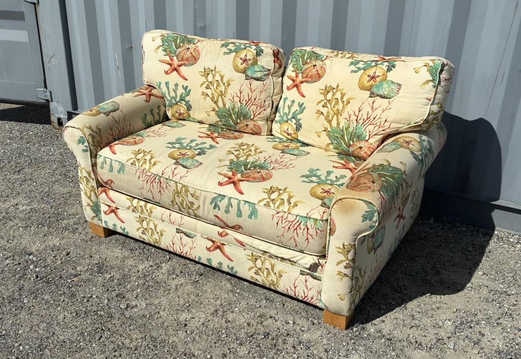 OCEAN PRINT UPHOLSTERED SOFA: OCEAN PRINT UPHOLSTERED SOFA A cozy comfy couch with rolled arms, square wooden legs, and a twin-cushion back. Displays an undersea theme, upholstered in a print featuring starfish, sand dollars, and