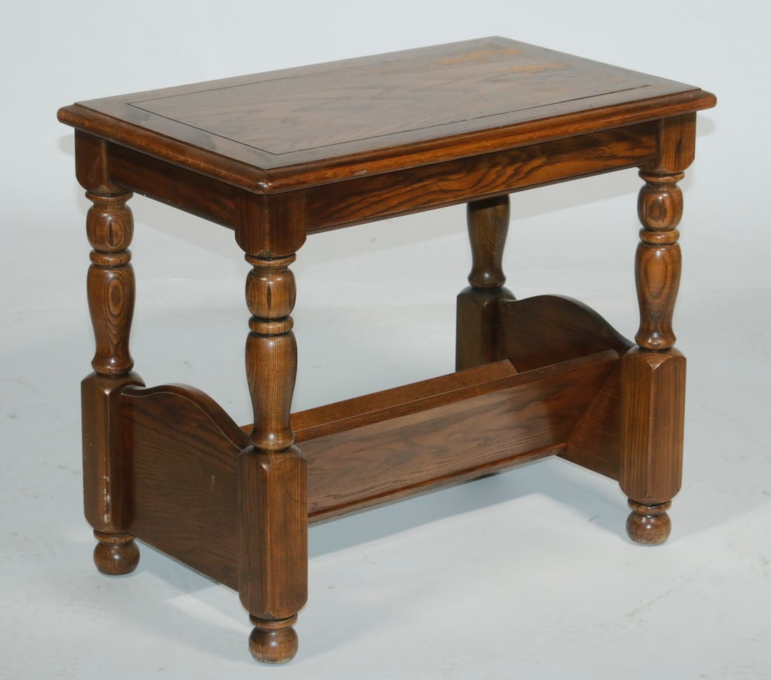 END TABLE WITH MAGAZINE RACK: END TABLE WITH MAGAZINE RACK Custom Chair-Side Table by Hammary Furniture, Lenoir, NC, walnut veneered surface with molded edge top, turned legs, angled base magazine rack, dated 1986, 22" high, 26"