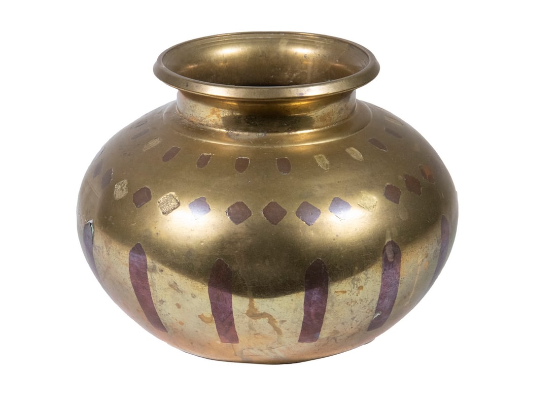 ARTS & CRAFTS PERIOD MIXED METAL VASE: ARTS & CRAFTS PERIOD MIXED METAL VASE Heavy Cast Brass, ovoid form with flared rim, having inlaid copper geometric forms. Some inlay missing, one dent. OS: 4 3/4 x 6 1/2 x 6 1/2 in. (12.1 x 16.5 x