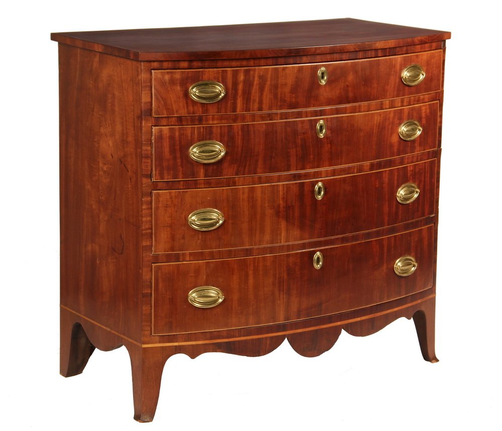 BOWFRONT CHEST - Hepplewhite Mahogany & String Inlaid: BOWFRONT CHEST - Hepplewhite Mahogany & String Inlaid Dresser with overhanging top, four graduated drawers, oval brass hardware, shaped skirt, on high flared feet. Coastal Mass., fourth quarter 18th c