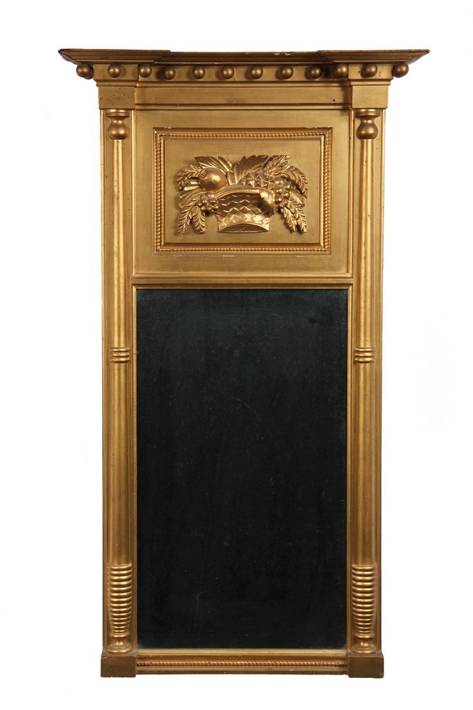 LOOKING GLASS - Circa 1820 Gilded Federal Period Mirror: LOOKING GLASS - Circa 1820 Gilded Federal Period Mirror with carved fruit basket on frieze, molded cornice, sixteen pendant spheres (one missing), split columns, molded base. 21" x 36 1/2". Small chip