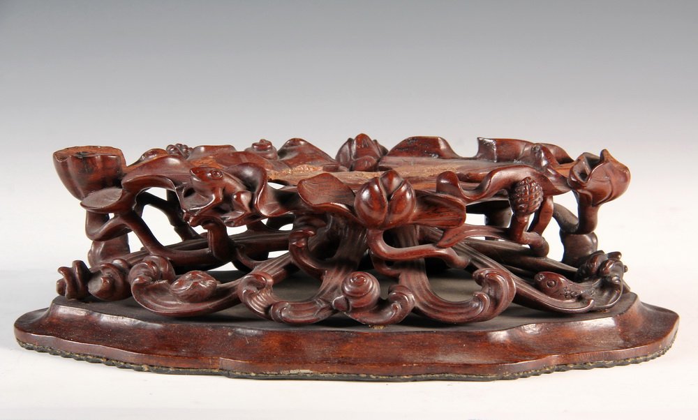 CARVED WOOD JAPANESE STAND - Detailed & Fully: CARVED WOOD JAPANESE STAND - Detailed & Fully Reticulated Exotic Wood Stand made up of waves & leaves, decorated with many frogs, fish, snails & water lillies, set on shaped base with ribbed underside