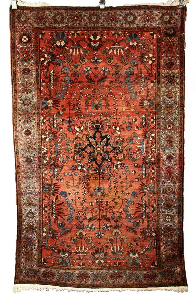 KASHAN RUG - 4' x 6'7" - West Central Persia, early: KASHAN RUG - 4' x 6'7" - West Central Persia, early 20th c, midnight blue rosette medallion set on a red mahogany field, decorated with rosettes, serrated leaves, vases and floral vines, in Persian bl