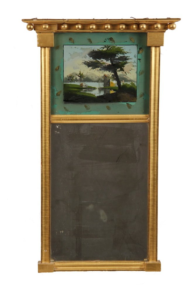 FEDERAL PERIOD LOOKING GLASS - Gilt Framed Mirror,: FEDERAL PERIOD LOOKING GLASS - Gilt Framed Mirror, circa 1810, with eglomise lake scene above, surrounded by gilt acorns, molded cornice with 14 pendant spheres. 29 3/4" x 18". Replaced mirror. From a