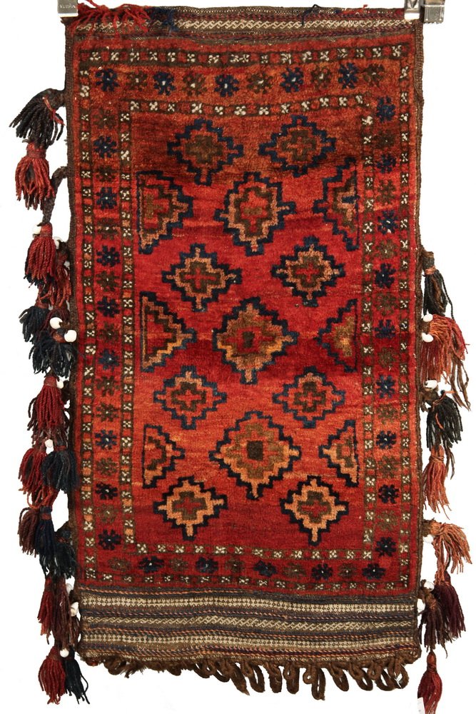 YOMUD CHUVAL (STORAGE BAG) - 2' x 3'9" - West: YOMUD CHUVAL (STORAGE BAG) - 2' x 3'9" - West Turkestan, second quarter 20th c, (7) staggered rows of 'Memling' guls in red, navy blue, royal blue, apricot and chocolate brown. Set on a wine red field