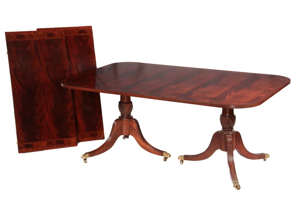 CONTEMPORARY DINING TABLE - Fine Quality Hepplewhite: CONTEMPORARY DINING TABLE - Fine Quality Hepplewhite Style Dining Table by Hickory Chair Co, in mahogany with string inlay and banded edge, double urn & tripod bases with brass caster, two 22" leaves.